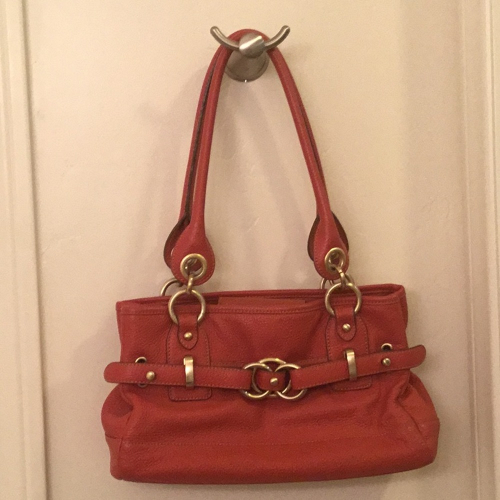Wilson Leather pebbled leather shoulder bag with gold hardware.